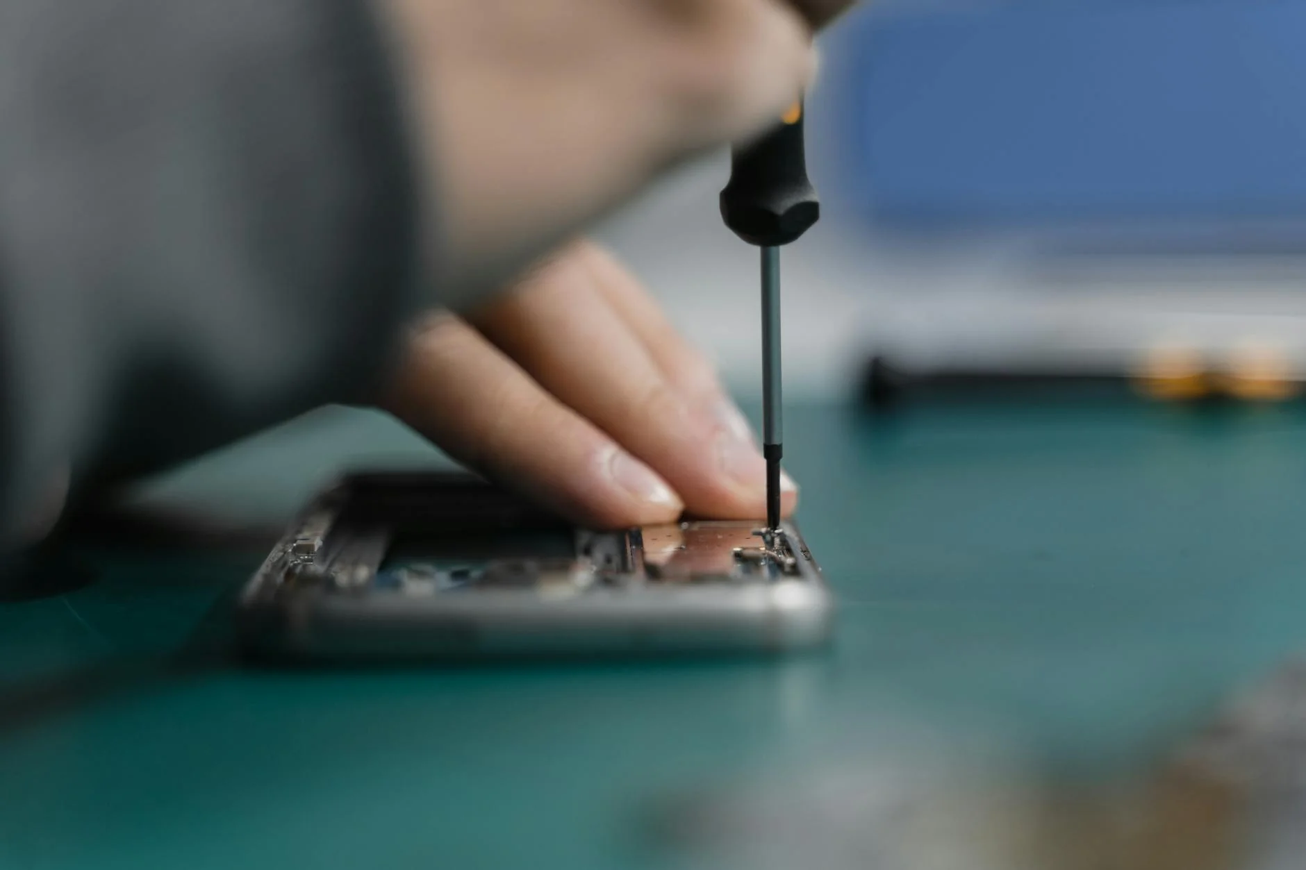 Technician replacing a phone screen illustrative graphic
